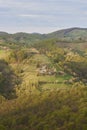 Amazing spring countryside landscape, houses and farmlands on the hills