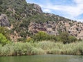 Amazing stone tombs in the rock on the river bank