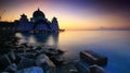 Amazing Straits Mosque of Malacca during sunrise with reflection Royalty Free Stock Photo