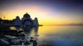 Amazing Straits Mosque of Malacca during sunrise with reflection Royalty Free Stock Photo