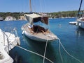 Little white fishing boat floating on sea