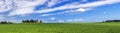 Amazing summer countryside with green pasture and blue sky with clouds - Czech Republic, Europe. Royalty Free Stock Photo