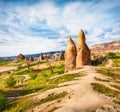 Amazing summer scene of Cappadocia with limestones peaks on background. Splendid morning view of of Red Rose valley. Cavusin villa