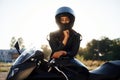 Amazing sunlight. Woman is with motorcycle outdoors