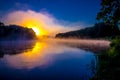 Cold sunrise near misty river