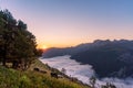 Amazing sunrise in the ossau valley. magnificent sea of clouds in the valley. pic du midi d`ossau in the background. portrait Royalty Free Stock Photo