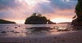 Amazing sunrise over ocean tropical beach. Dramatic colorful cloudy sky. Orange colors waves. Nature background Royalty Free Stock Photo