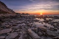 Sunrise over the rocky coast sea. Royalty Free Stock Photo