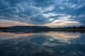 Amazing sunrise view over Danube river, beautiful reflections of morning clouds mirrored in water, Esztergom, Hungary Royalty Free Stock Photo