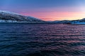 Amazing sunset with amazing magenta color over fjord Tromso, Norway. Polar night. long shutter speed Royalty Free Stock Photo