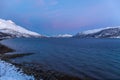 Amazing sunset with amazing magenta color over fjord Tromso, Norway. Polar night. long shutter speed Royalty Free Stock Photo