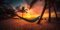 Amazing sunset by the beach with hammock among palm trees Royalty Free Stock Photo