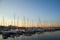 Amazing sunset, boats in the harbor, yachts in a bay of lake at sunset light.