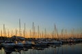 Amazing sunset, boats in the harbor, yachts in a bay of lake at sunset light.
