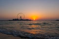 Amazing sunset colors over the sea view to the Ain Dubai, giant Ferris at Bluewaters Island  close to JBR beach. Royalty Free Stock Photo