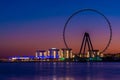 Amazing sunset colors over the sea view to the Ain Dubai, giant Ferris at Bluewaters Island close to JBR beach. Royalty Free Stock Photo