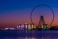 Amazing sunset colors over the sea view to the Ain Dubai, giant Ferris at Bluewaters Island close to JBR beach.