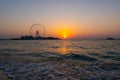 Amazing sunset colors over the sea view to the Ain Dubai, giant Ferris at Bluewaters Island  close to JBR beach. Royalty Free Stock Photo