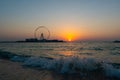 Amazing sunset colors over the sea view to the Ain Dubai, giant Ferris at Bluewaters Island  close to JBR beach. Royalty Free Stock Photo