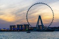 Amazing sunset colors over the sea view to the Ain Dubai, giant Ferris at Bluewaters Island close to JBR beach. Royalty Free Stock Photo