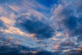 Amazing sunset cumulus and cirrus cloud on blue sky. Nature, climate background, toned photo