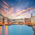 Amazing sunset and evening cityscape of Venice with famous Canal Grande and Rialto Bridge Royalty Free Stock Photo