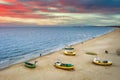 Amazing sunset with fishing boats at the beach of Baltic Sea in Sopot, Poland Royalty Free Stock Photo