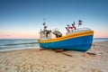 Amazing sunset with fishing boats at the beach of Baltic Sea in Sopot, Poland Royalty Free Stock Photo