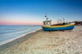 Amazing sunset with fishing boats at the beach of Baltic Sea in Sopot, Poland Royalty Free Stock Photo