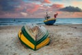 Amazing sunset with fishing boats at the beach of Baltic Sea in Sopot, Poland Royalty Free Stock Photo