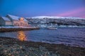 Amazing sunset with amazing magenta color over fjord Tromso, Norway. Polar night. long shutter speed Royalty Free Stock Photo