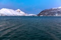 Amazing sunset with amazing magenta color over fjord Tromso, Norway. Polar night. long shutter speed Royalty Free Stock Photo