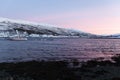 Amazing sunset with amazing magenta color over fjord Tromso, Norway. Polar night. long shutter speed Royalty Free Stock Photo