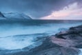 Amazing Sunset Over Mountain And Fjord, Winter Landscape, Norway The sun sets on the Norwegian Alps and the blue hour. Royalty Free Stock Photo