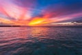 Amazing sunset over the ocean. Colorful reflection in the water. Royalty Free Stock Photo