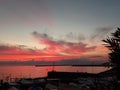 An amazing sunset over the sea of Genova in spring days with some people Royalty Free Stock Photo