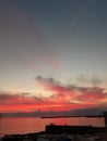 An amazing sunset over the sea of Genova in spring days with some people Royalty Free Stock Photo