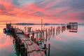 Amazing sunset on the palatial pier of Carrasqueira, Alentejo, Portugal. Wooden artisanal fishing port Royalty Free Stock Photo