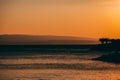 Amazing sunset seascape. Palm trees and orange sky. Brela Croatia, Makarska riviera Royalty Free Stock Photo