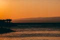 Amazing sunset seascape. Palm trees and orange sky. Brela Croatia, Makarska riviera Royalty Free Stock Photo