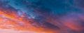 Amazing Sunset Sky With Saturated Colorful Clouds. Scenic View Dramatic Sky. Sun Shining With Sun Rays. Orange Red