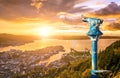 Amazing sunset view of City of Bergen from Floyen mountain and a public Binocular. Norway. Royalty Free Stock Photo