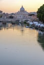 Amazing Sunset view of Tiber River, St. Angelo Bridge and St. Peter`s Basilica in Rome, Italy Royalty Free Stock Photo