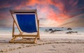 Amazing sunset watched from deck chair at white beach in Ko Lipe, Thailand