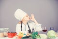 Amazing taste. Turn ingredients into delicious meal. Culinary skills. Woman chef wear hat apron near table ingredients Royalty Free Stock Photo