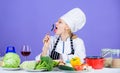 Amazing taste. Woman chef wear hat apron near table ingredients. Girl adorable chef teach culinary. Best culinary Royalty Free Stock Photo