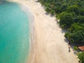 Aerial view of an amazing white sandy beach with turquoise water in tropical country Royalty Free Stock Photo