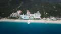 Amazing top view on tropical luxury hotel With swimming pool at near ocean. Video. Top view of the luxury hotel near the Royalty Free Stock Photo