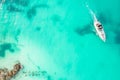 Amazing top view of yacht. Aerial view of luxury floating small ship in blue Caribbean sea. Yacht at the sea in Cancun Royalty Free Stock Photo
