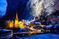 amazing touristic alpine village at night in winter with famous church and Staubbach waterfall Lauterbrunnen Switzerland Europe